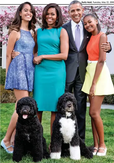  ??  ?? Lights, camera... Barack and Michelle Obama with daughters Malia and Sasha and their dogs