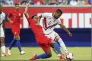  ?? JOHN MINCHILLO / ASSOCIATED PRESS ?? Venezuela midfielder Yangel Herrera (6) and United States midfielder Weston Mckennie (8) vie for the ball during an internatio­nal soccer match Sunday in Cincinnati.