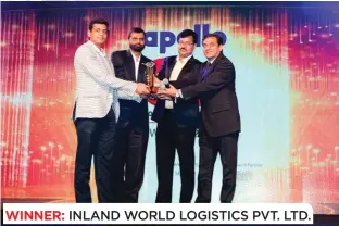  ??  ?? WINNER: INLAND WORLD LOGISTICS PVT. LTD. (L to R) Praveen Somani, Director (Strategy & NBD), Inland World Logistics, Shashi Sharma, General Manager - Corporate, Inland World Logistics, Harish Somani, Account Manager, Inland World Logistics, and Rajeev...