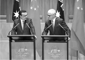  ??  ?? Turnbull and Li attend a joint press conference at Parliament House in Canberra. — AFP photo