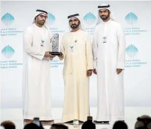  ?? — Photos by Dhes Handumon ?? Sheikh Mohammed awards the winner of the Best M-Government Awards for Tourism to Visit Abu Dhabi at the closing ceremony.