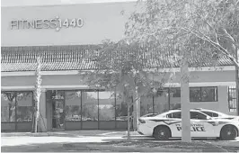  ?? SOUTH FLORIDA SUN SENTINEL WAYNE K. ROUSTAN/ ?? Plantation police remained outside the Fitness 1440 gym to make sure owner Michael Carnevale did not open it again following his third arrest for failing to follow Broward County COVID-19 safety guidelines including requiring patrons to wear face masks when exercising. On Wednesday, the Florida clemency board issued pardons for all violators.