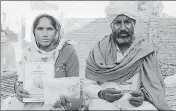  ?? SANJEEV KUMAR/HT ?? Baldev Singh and his wife showing ‘Bhagat Puran Singh health insurance scheme’ card in Bathinda on Thursday.