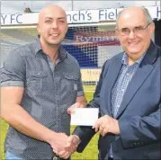  ?? Picture: Tony Flashman FM2746615 ?? FINANCIAL BOOST: Michael Monks, owner of Cube Hair Design, in Mortimer Street, presents a £500 cheque to Bay commercial manager Ronald Boddy. The money will be used to kit out the disability team.