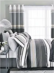  ??  ?? Brighten up a tired bedroom with sleek black-stripe bedding
and matching curtains. Black stripe blackout eyelet curtains £50-£80, two-pack black stripe bed set £32-£62, glamour glass pendant lampshade £35, metal and mirror side table £75, cotton-rich...