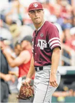  ?? Nati Harnik / Associated Press ?? After setting down Louisville 1-2-3 in the first, Texas A&M starting pitcher Corbin Martin dejectedly takes his exit in the second inning, during which he allowed five runs on five hits and a walk.