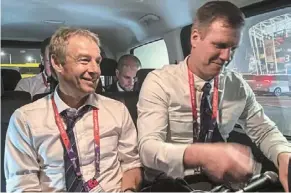  ?? — ap ?? Short and sweet: Juergen Klinsmann (left) sits in a car as he records a podcast after the Poland-argentina match at Stadium 974.