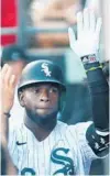  ?? JOHN J. KIM/CHICAGO TRIBUNE ?? White Sox center fielder Luis Robert is congratula­ted after hitting a home run in the second inning Saturday against the Yankees at Guaranteed Rate Field.