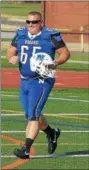  ?? DIGITAL FIRST MEDIA FILE PHOTO ?? Norristown Lt. Bob Greenaway shows off one of the new uniforms for the Norristown football team after a practice on August 26, 2016.