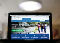  ?? AP Photo/ Pablo Martinez Monsivais,
File ?? left The HealthCare.gov 2017 website home page is seen Oct. 24 in Washington. One by one, key health care industry groups are telling the incoming Republican administra­tion and Congress that it’s not a good idea to repeal the 2010 health care law...