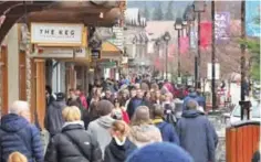  ?? ?? BANFF, Canada: People stroll through the town of Banff inside Banff National Park, Alberta.