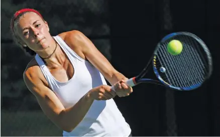  ?? STAFF PHOTO BY DOUG STRICKLAND ?? Baylor’s Ashton Jenne returns the ball during her doubles match with teammate Drew Hawkins against GPS’s Maddox Bandy and Corrinne Spann on Wednesday at Baylor School. Hawkins and Jenne won 8-3, and Baylor won 7-0.