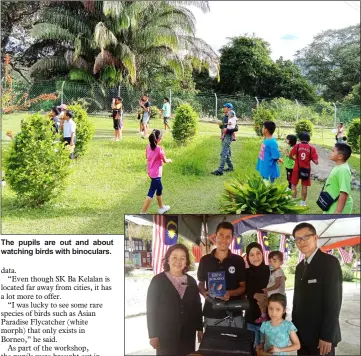  ??  ?? The pupils are out and about watching birds with binoculars. Iqbal (second left), with his wife (third left) and two daughters in a photocall with Bulan (left) and Sang Sigar.