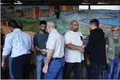  ?? HASSAN AMMAR — THE ASSOCIATED PRESS ?? Relatives of Taline al-Hamoui and her mother, Rihab, who were killed after a boat sank with migrants, receive condolence­s after their funeral in Tripoli, Lebanon, on Wednesday.