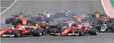  ?? —AFP ?? SPIELBERG: Drivers steer their cars after the start during the Formula One Austria Grand Prix at the Red Bull Ring in Spielberg.