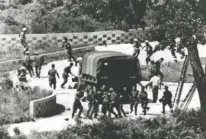  ?? YONHAP VIA AP, FILE ?? North Korean soldiers attack United Nations Command personnel wearing helmets on Aug. 18, 1976, at the truce village of Panmunjom, South Korea.