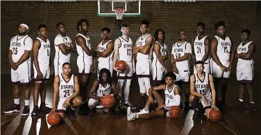  ?? Contribute­d ?? Starstruck: The South Arkansas Community College Stars stand in the gym building at the school’s West Campus. The gym is being renovated so that the team may hold home games on campus next season.