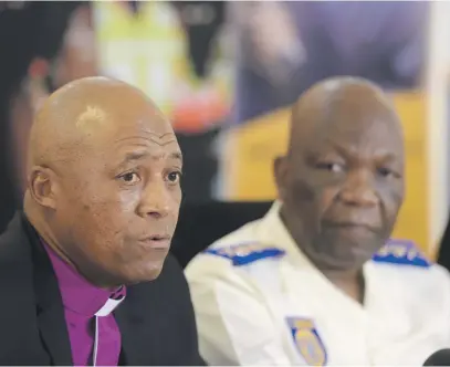  ?? Picture: Tracy Lee Stark ?? NO NONSENSE. Johannesbu­rg Metropolit­an Police Department chief David Tembe, right, and Bishop Mosa Sono of Grace Bible church speak to the media yesterday.