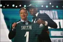  ?? TONY DEJAK — THE ASSOCIATED PRESS ?? Alabama wide receiver DeVonta Smith, right, holds up and Eagles jersey with NFL Commission­er Roger Goodell after Smith was chosen by the Birds with the 10th pick in the first round of the NFL Draft last Thursday in Cleveland.
