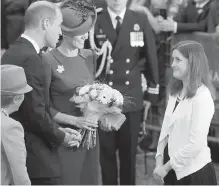  ?? ADRIAN LAM, TIMES COLONIST ?? Victoria Foster, of Ottawa, presents flowers to the Duchess of Cambridge on Saturday. Victoria, 14, has cystic fibrosis. Her wish to meet the Royal Family was made possible by the Children’s Wish Foundation of Canada.