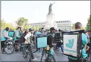  ??  ?? This file photo shows Bike delivery people from the Deliveroo food delivery service gather for a demonstrat­ion at Place de la Republique in Paris.