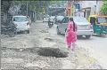  ??  ?? A rain damaged road on Rana Pratap Marg.