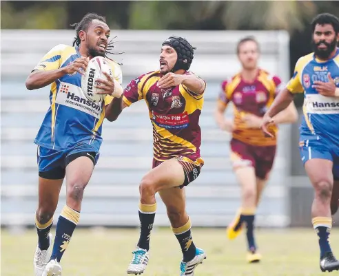  ??  ?? DESPERATIO­N PLUS: Suburbs player Caleb Foster won’t give up in his pursuit of Kangaroos player James Lui yesterday.