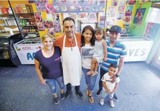  ??  ?? The family behind Paleteria y Neveria Oasis, from left: Elizabeth Chavez, Oscar Castañeda, Erika Castañeda, Sofia Reyes, 2, Omar Reyes and Damian Reyes, 6.