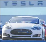  ?? AP FILE PHOTO/ DAVID ZALUBOWSKI ?? An unsold 2021 S70 sedan sits at a Tesla dealership in Littleton, Colo.