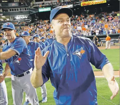 ?? THE ASSOCIATED PRESS ?? After guiding the Toronto Blue Jays to the teams’ first American League East title in over 20 years, there are some who believe John Gibbons should be in line for American League coach of the year honours. Others, however, may contend Gibbons simply...