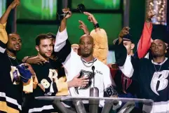  ??  ?? DMX, centre, accepts the R&B Album Artist of the Year during the 1999 Billboard Music Awards in Las Vegas (AP)