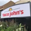  ?? AP PHOTOS ?? CRUNCH TIME: The headquarte­rs of Taco John’s. Taco John's recently sent Freedom’s Edge Brewing Co. — located in the taco chain’s hometown of Cheyenne, Wyo. — a cease-anddesist letter for using ‘Taco Tuesday’ to advertise a taco truck parked outside.