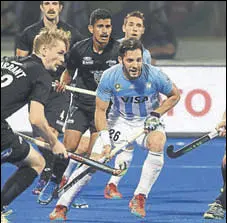  ?? AFP ?? Argentina's Agustin Mazzilli (in blue) in action against New Zealand at the hockey World Cup in Bhubaneswa­r on Monday.