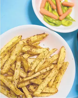  ?? DREAMSTIME ?? For evenly browned and crispy fries, spread them in a single layer in the air fryer basket.