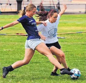  ?? JIM THOMPSON/JOURNAL ?? Bianca Sikora, left, defends teammate Sarah Torres during a practice for the AUFC 00 Fusion on Thursday in preparatio­n for the Far West Regionals in Hawaii.