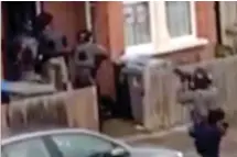  ??  ?? Raid: Anti-terrorism police burst into the house