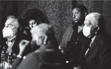  ?? Photos by Robin Jerstad / Contributo­r ?? Trésor Rusesabagi­na, whose father is in a Rwanda prison, listens to panelists Friday at the Tobin Center as they praise the regime of Paul Kagame without mentioning its human rights record.