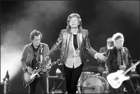  ?? STEVE MARCUS ?? Mick Jagger, center, sings while f lanked by Rolling Stones bandmates Ronnie Wood, left, and Keith Richards, right, Saturday during the Stones’ Hackney Diamonds Tour stop at Allegiant Stadium.