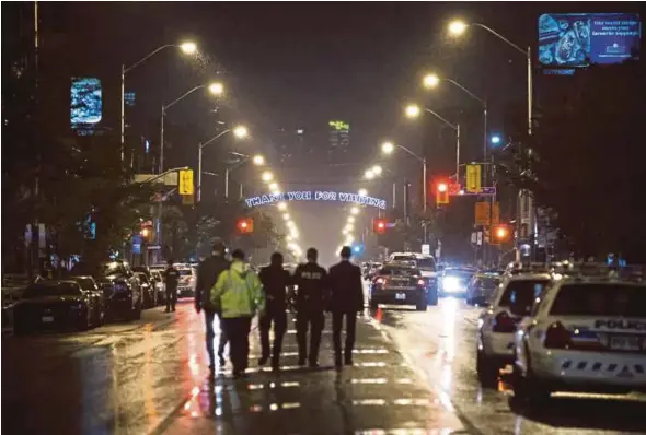  ?? AFP PIC ?? Police officers at the scene of a shooting in Toronto, Ontario, yesterday.