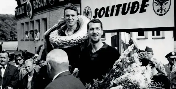  ??  ?? Above Gurney and Bonnier enjoying the spoils of winning on Porsche’s home turf, Solitude, 1962