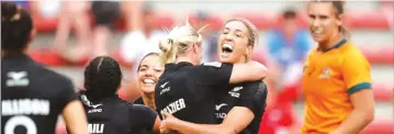  ?? ?? Black Ferns of New Zealand celebrate after beating Wallaroos of Australia in a Rugby match