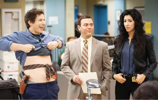  ?? FOX ?? Even Brooklyn Nine-Nine, a comedy series known for its diverse cast including Andy Samberg, left, Joe Lo Truglio and Stephanie Beatriz, trots out the hoary trope of the white male hero.