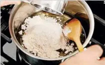  ??  ?? Roux (a mixture of fat and flour) is one way to thicken a gumbo. Start it by cooking equal amounts of fat and flour together.