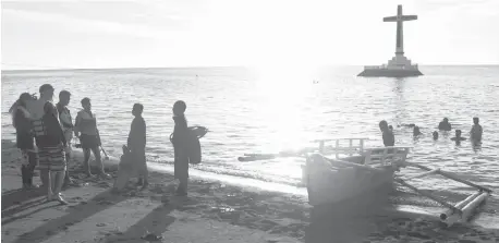  ??  ?? THE Sunken Cemetery in Barangay Bonbon, Catarman, Camiguin, is one of the tourist destinatio­ns in the island-province, where devotees flock to take part in the annual “Panaad” (vow) by walking its 64-kilometer circumfere­ntial road as a form of penance. (PNA)