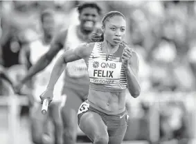  ?? Steph Chambers/Getty Images ?? For the first 200 meters of her last lap around the track, Felix extended her lead before she was caught by Marileidy Paulino of the Dominican Republic.