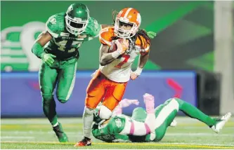  ?? THE CANADIAN PRESS ?? B.C. Lions wide receiver Shakeir Ryan shakes a tackle during second-half CFL action against the Saskatchew­an Roughrider­s in Regina on Saturday.