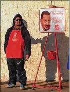  ?? PROVIDED ?? Dion Green volunteere­d for the Salvation Army to honor the memory of his father, Derrick Fudge and whose image was on a poster above the kettle. His dad was killed in the Oregon District mass shooting.