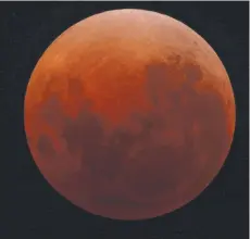  ?? Picture: MARTIN GEORGE ?? ALL AGLOW: A total lunar eclipse that occurred in 2018, showing the typical coppery-red colour. During an eclipse in the year 1110, the Moon disappeare­d completely.