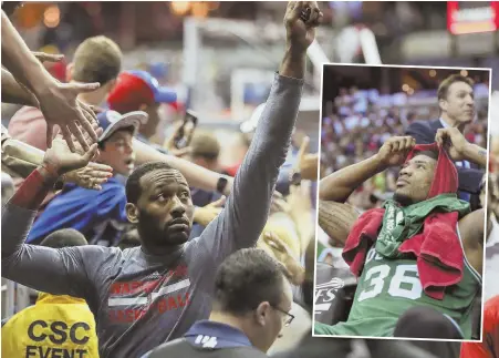  ?? AP PHOTO ?? VERIZON CALLING: Marcus Smart reacts on the Celtics bench during last Sunday’s Game 4 loss in Washington, while the Wizards’ John Wall greets fans after the victory. The Celtics will look to finally get a road win in the series and close things out in...