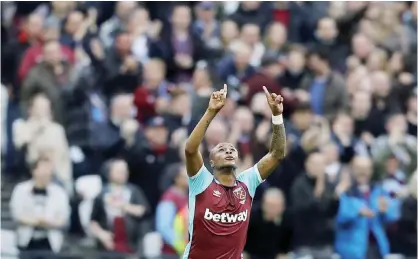  ?? — AP ?? LONDON: West Ham’s Andre Ayew celebrates after scoring during the English Premier League soccer match between West Ham and Leicester City at London Stadium in London.